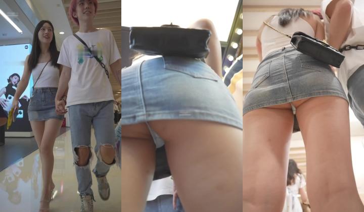 超短牛仔裙美女在商场 光脚穿袜子试鞋高跟鞋配玉足脚上的血管清晰可见丁字裤翘臀弯腰被抄底